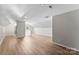 Large bonus room featuring hardwood floors, neutral tones, and natural light at 329 Squirrel Ln, Clover, SC 29710