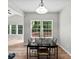 Light-filled dining area with hardwood floors and views of the backyard at 329 Squirrel Ln, Clover, SC 29710