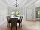 Formal dining area with decorative moldings and plenty of room to entertain dinner guests at 329 Squirrel Ln, Clover, SC 29710