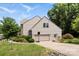 Home exterior with a garage, basketball hoop, well-maintained lawn and manicured landscaping at 329 Squirrel Ln, Clover, SC 29710