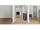 Inviting home hallway with tile flooring and a view into the spacious living room at 329 Squirrel Ln, Clover, SC 29710