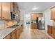 Well-lit kitchen with stainless steel appliances, granite countertops, and ample cabinet space at 329 Squirrel Ln, Clover, SC 29710