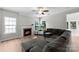Spacious living room with a fireplace, fan, and lots of natural light at 329 Squirrel Ln, Clover, SC 29710