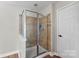 This bathroom shower has tile surround and glass door at 329 Squirrel Ln, Clover, SC 29710