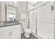 Bright bathroom featuring a glass shower enclosure, granite vanity top, and modern fixtures at 4707 Kingswood Dr, Fort Mill, SC 29707