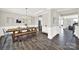 Bright dining room with wood floors, modern chandelier, and trim work, perfect for entertaining at 4707 Kingswood Dr, Fort Mill, SC 29707