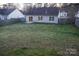Spacious backyard with a sliding glass door and privacy fence perfect for outdoor activities at 4718 Sahalee Ln, Charlotte, NC 28216