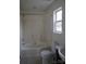 Clean bathroom featuring a tub and shower, a toilet, and a single sink vanity at 4718 Sahalee Ln, Charlotte, NC 28216