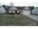Charming single-story home features a manicured front yard and attached one car garage at 4718 Sahalee Ln, Charlotte, NC 28216