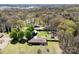 Expansive aerial view of a property with lush green landscaping and detached garage near a wooded area at 4937 Lebanon Dr # 1, Charlotte, NC 28273