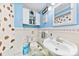 Quaint bathroom with bright blue walls, tile flooring, and a vintage sink at 4937 Lebanon Dr # 1, Charlotte, NC 28273