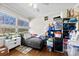 Bright bedroom featuring a chaise lounge and large window for natural light at 4937 Lebanon Dr # 1, Charlotte, NC 28273