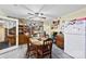 Bright kitchen and dining area showcasing stone accent wall, wood cabinetry, and lots of storage at 4937 Lebanon Dr # 1, Charlotte, NC 28273