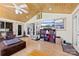 Bright sunroom with wood paneled ceilings featuring sliding glass doors that allow easy access to the outdoors at 4937 Lebanon Dr # 1, Charlotte, NC 28273