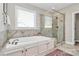 Bright bathroom features a soaking tub, walk-in shower, and tile surround at 5019 Mill Creek Rd, Clover, SC 29710