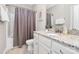 A well-maintained bathroom featuring a granite countertop, framed mirror, and tiled floors for a clean look at 5019 Mill Creek Rd, Clover, SC 29710