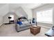 A comfortable bonus room with a large sofa, perfect for relaxing or entertaining guests at 5019 Mill Creek Rd, Clover, SC 29710