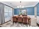 Cozy dining room features a large window, traditional rug and wood dining table at 5019 Mill Creek Rd, Clover, SC 29710