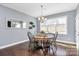 Dining room with wood table, chairs, large window and wood floors at 5019 Mill Creek Rd, Clover, SC 29710
