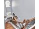 Two-story foyer showcasing hardwood floors, a staircase with iron spindles, and large arched window at 5019 Mill Creek Rd, Clover, SC 29710
