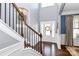 Bright, two-story foyer with staircase and view to formal living room at 5019 Mill Creek Rd, Clover, SC 29710