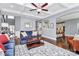 Open living room with coffered ceilings, hardwood floors, and seamless access to the kitchen and dining area at 5019 Mill Creek Rd, Clover, SC 29710