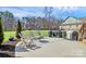 Gather on the patio, complete with outdoor seating, grill and views of the expansive backyard at 5019 Mill Creek Rd, Clover, SC 29710