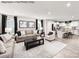 Bright living room with modern decor, stylish furniture, and an adjacent modern kitchen at 521 Nesbe St # 2211, Lancaster, SC 29720