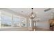 Bright dining area featuring hardwood floors, modern lighting, and large windows at 5950 Mantle Way, Kannapolis, NC 28081