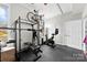 This home gym features workout equipment and two windows at 702 Shearers Rd, Mooresville, NC 28115