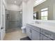 Modern bathroom with a glass shower, gray vanity, and quartz countertops at 826 Misty Arbor Frd, Clover, SC 29710