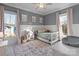 Charming bedroom with floral accents, a white bed frame, and natural light at 826 Misty Arbor Frd, Clover, SC 29710