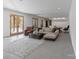 Spacious living room with a large sectional sofa, area rug, and natural light from the french doors at 826 Misty Arbor Frd, Clover, SC 29710