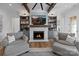 Inviting living room with stone fireplace, built-in bookshelves, and hardwood floors at 826 Misty Arbor Frd, Clover, SC 29710