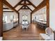Open concept living space with hardwood floors, exposed beams, and dining area at 826 Misty Arbor Frd, Clover, SC 29710