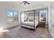 Bright bedroom with canopy bed, tray ceilings, and large windows with water views at 826 Misty Arbor Frd, Clover, SC 29710