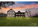 Expansive back of home with covered decks and balconies overlooking large yard at 826 Misty Arbor Frd, Clover, SC 29710