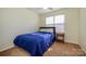 Bedroom featuring a window, ceiling fan and a side table at 8422 Chaceview Ct, Charlotte, NC 28269