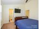 Bedroom view including mounted television and attached bathroom at 8422 Chaceview Ct, Charlotte, NC 28269