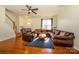 Open-concept living room with hardwood floors, and ample seating at 8422 Chaceview Ct, Charlotte, NC 28269