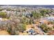 Aerial view of neighborhood with houses and lots of trees at 8624 Sharonbrook Dr, Charlotte, NC 28210