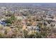 Expansive aerial view of a residential neighborhood featuring tree-lined streets and diverse home styles at 8624 Sharonbrook Dr, Charlotte, NC 28210