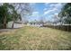 A spacious backyard with a shed and a house beyond at 8624 Sharonbrook Dr, Charlotte, NC 28210