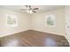 Spacious bedroom with hardwood floors, ceiling fan and natural light at 8624 Sharonbrook Dr, Charlotte, NC 28210