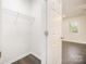 Walk-in closet with wire shelving and modern hardwood flooring at 8624 Sharonbrook Dr, Charlotte, NC 28210