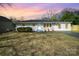 Lovely single-story home showcasing a beautiful sunset sky and appealing curb appeal at 8624 Sharonbrook Dr, Charlotte, NC 28210
