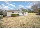 Well-maintained single-story home featuring a fresh exterior paint and new landscaping at 8624 Sharonbrook Dr, Charlotte, NC 28210
