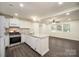 Bright kitchen featuring granite countertops, stainless steel appliances, and an open layout at 8624 Sharonbrook Dr, Charlotte, NC 28210