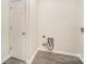 Laundry room with gray floors and a door and utility hookups at 8624 Sharonbrook Dr, Charlotte, NC 28210