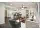 Inviting living room open to kitchen, with hardwood floors, modern decor, and plenty of natural light at 8624 Sharonbrook Dr, Charlotte, NC 28210